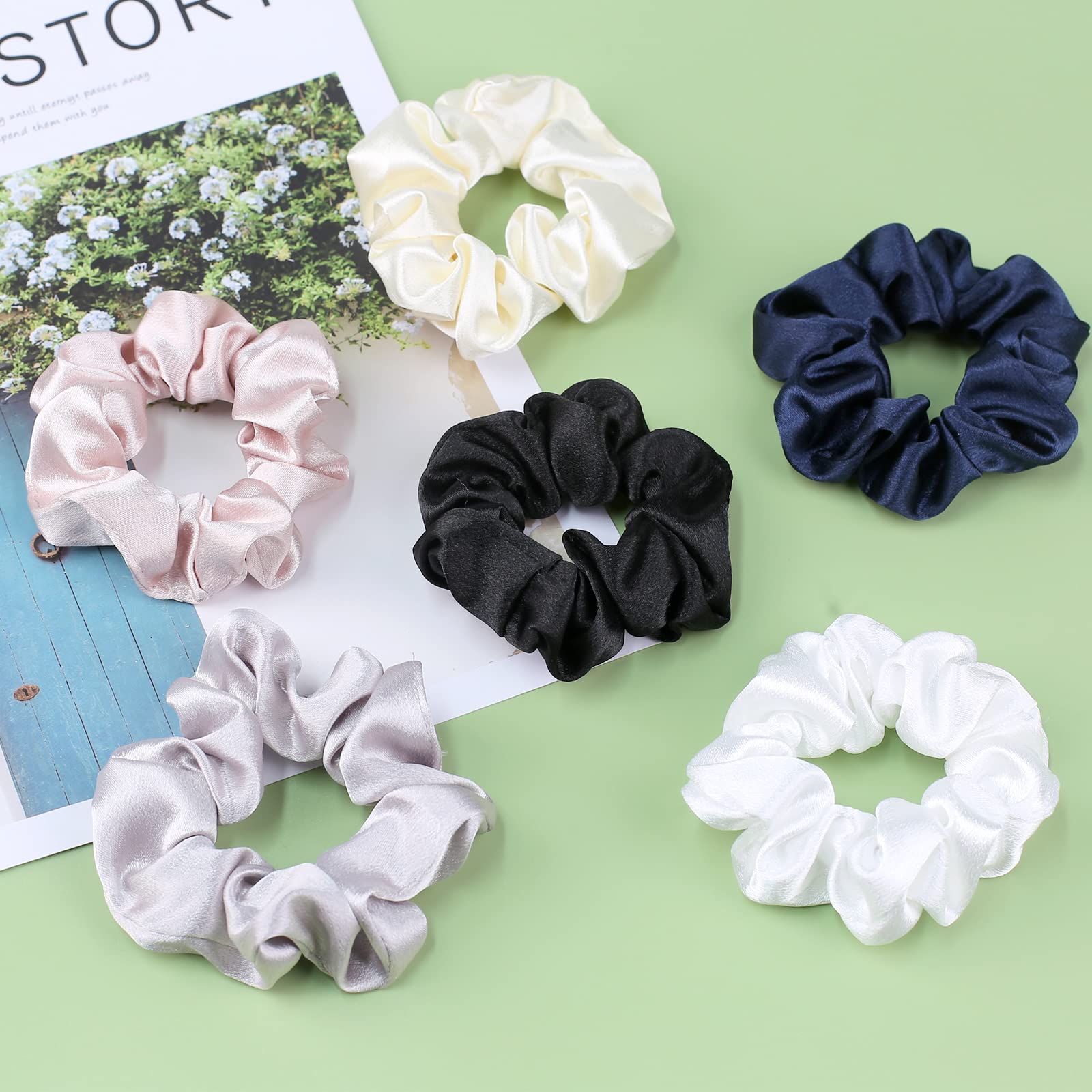 Premium satin hair bands stretched to demonstrate strong elastic core durability