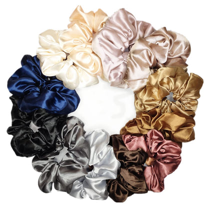Multi-colored satin silk hair scrunchies set arranged neatly to show the twelve distinct shades