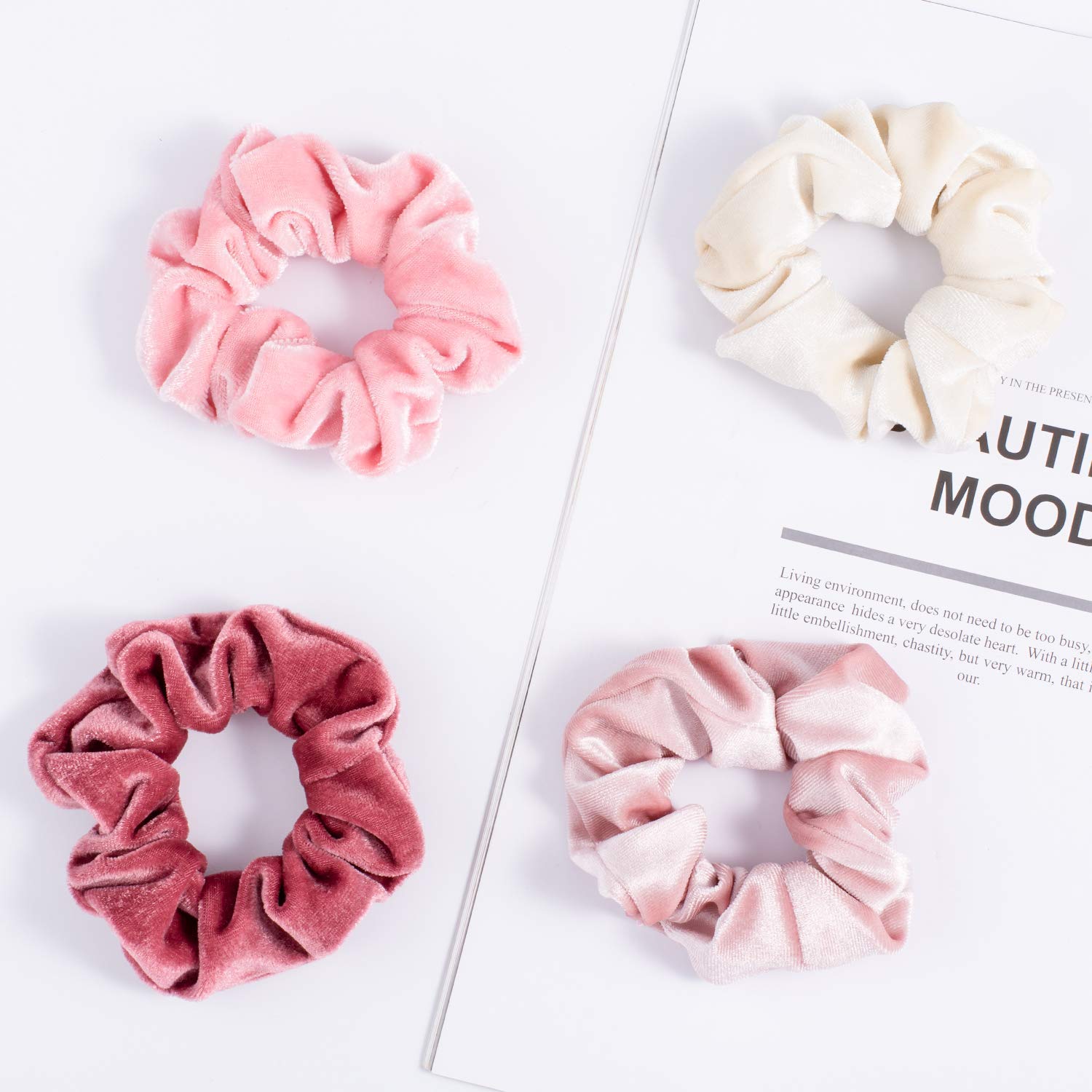 Model with thick curly hair wearing a pink Whaline velvet scrunchie in a high ponytail.