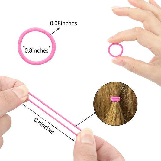 Close-up view of a single two-centimeter small finger size colorful toddler hair elastic being stretched to demonstrate flexibility.