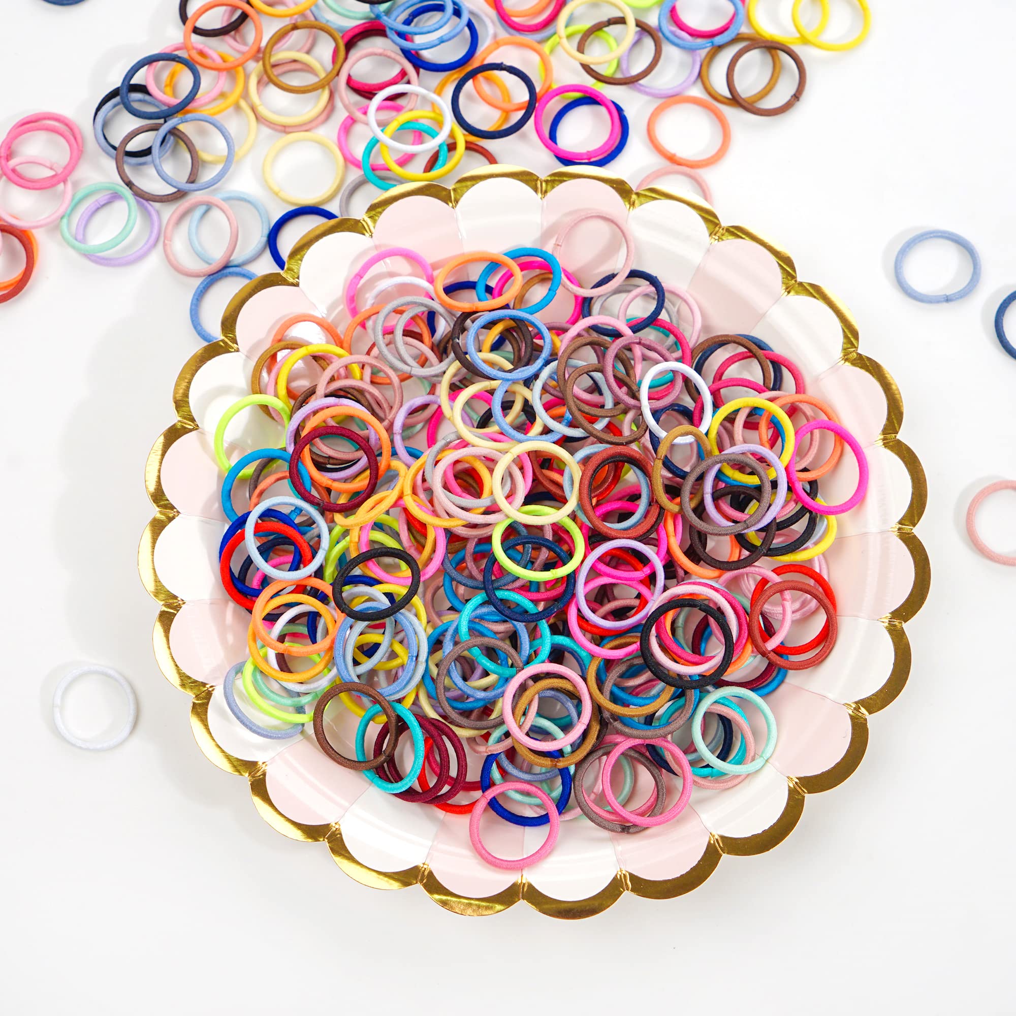 Detailed shot of the soft premium material texture of the damage-free pastel and bright colored children ponytail holders.