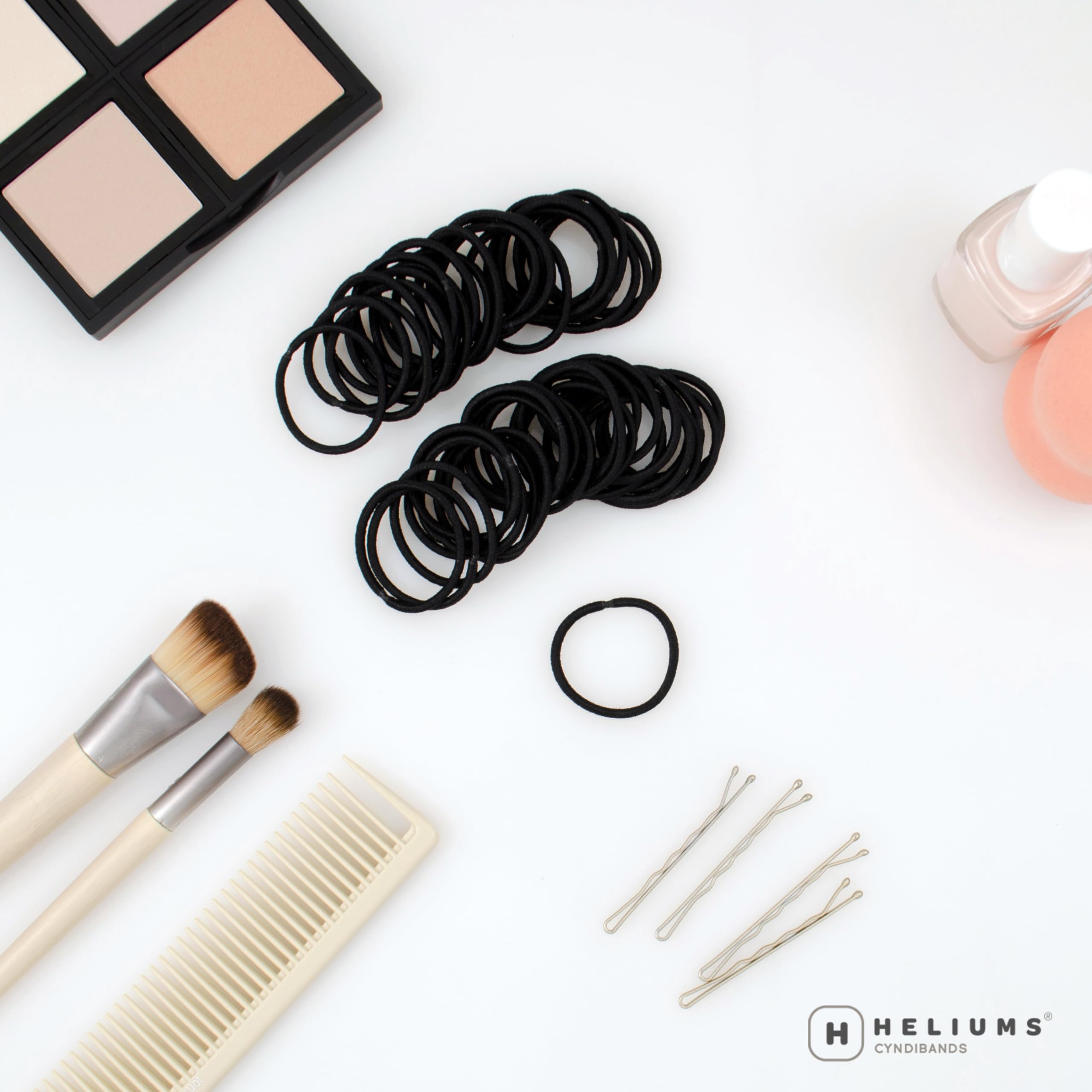 Close up view of the two millimetre thick fabric covered mini hair elastics