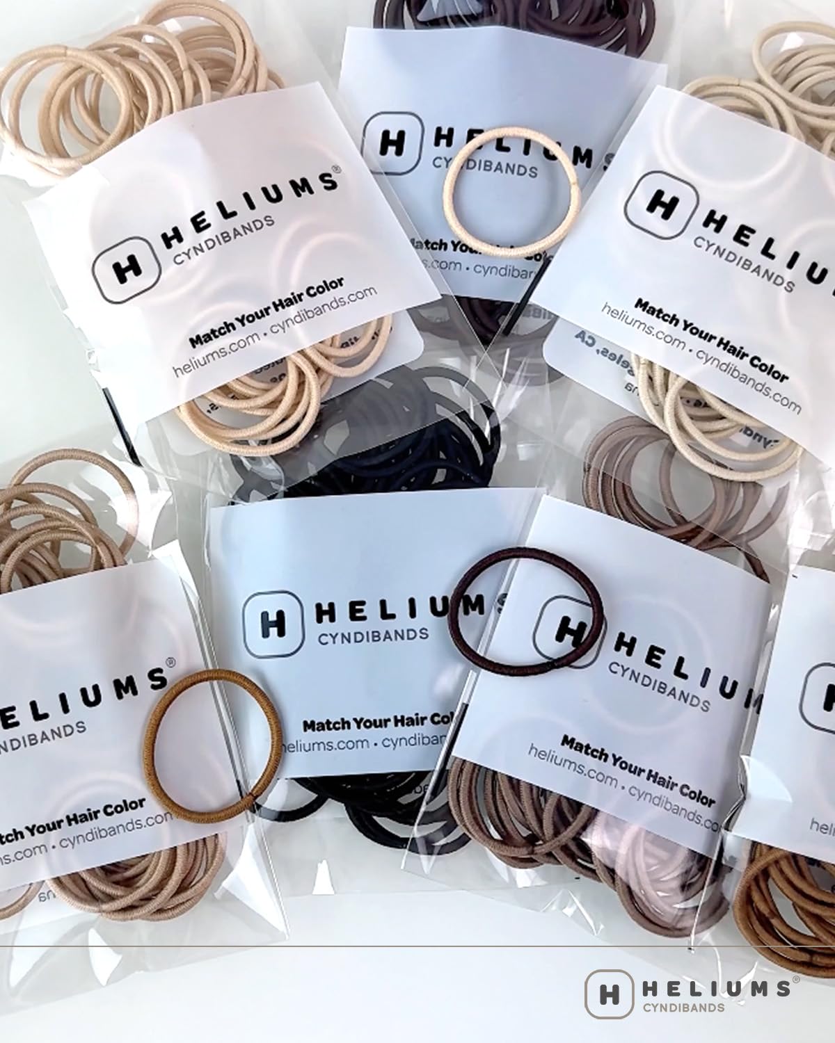 Packaging back view of Heliums small hair ties with safety instructions