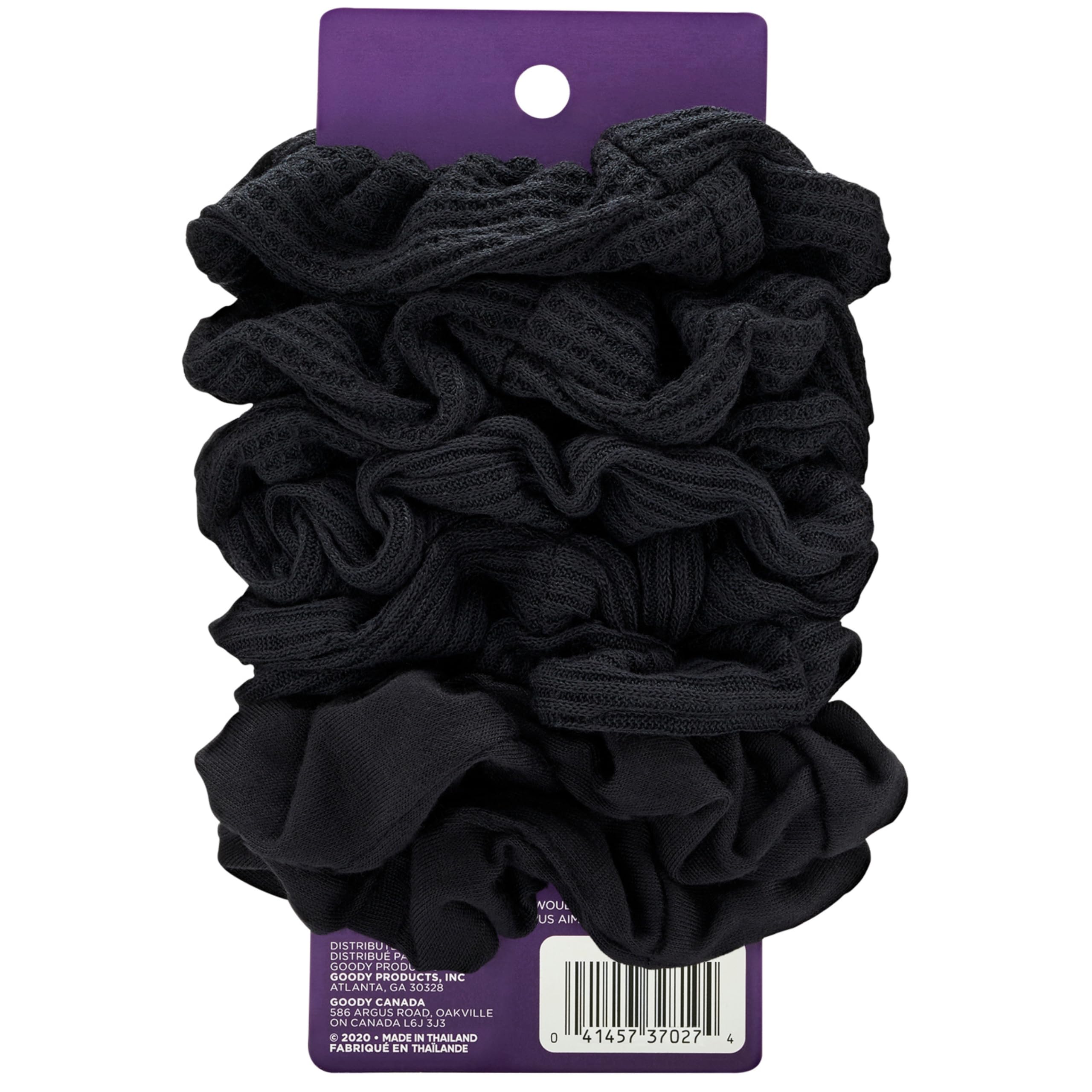 Eight black jersey fabric hair ties displayed together