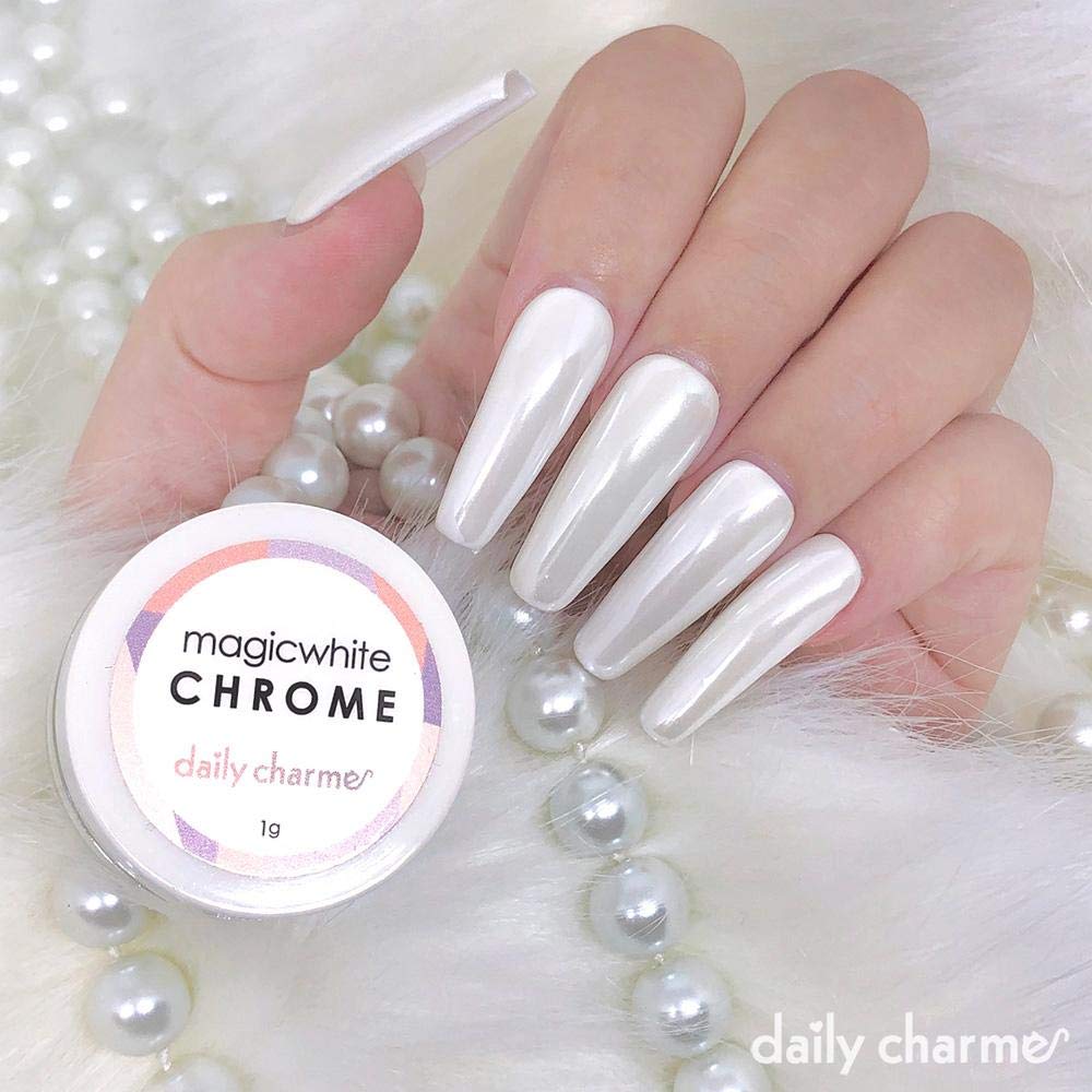 Professional application of Daily Charme chrome powder on manicure
