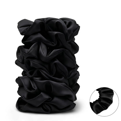 An elegant lifestyle presentation of the black satin set perfect for gifting.