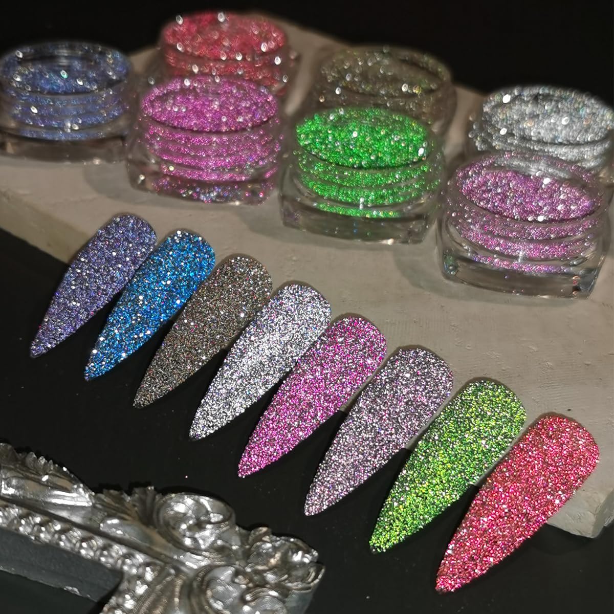 Selection of silver pink and purple glitter nail powders