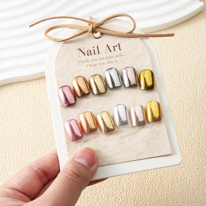 Applying metallic mirror pigment to nails with applicator