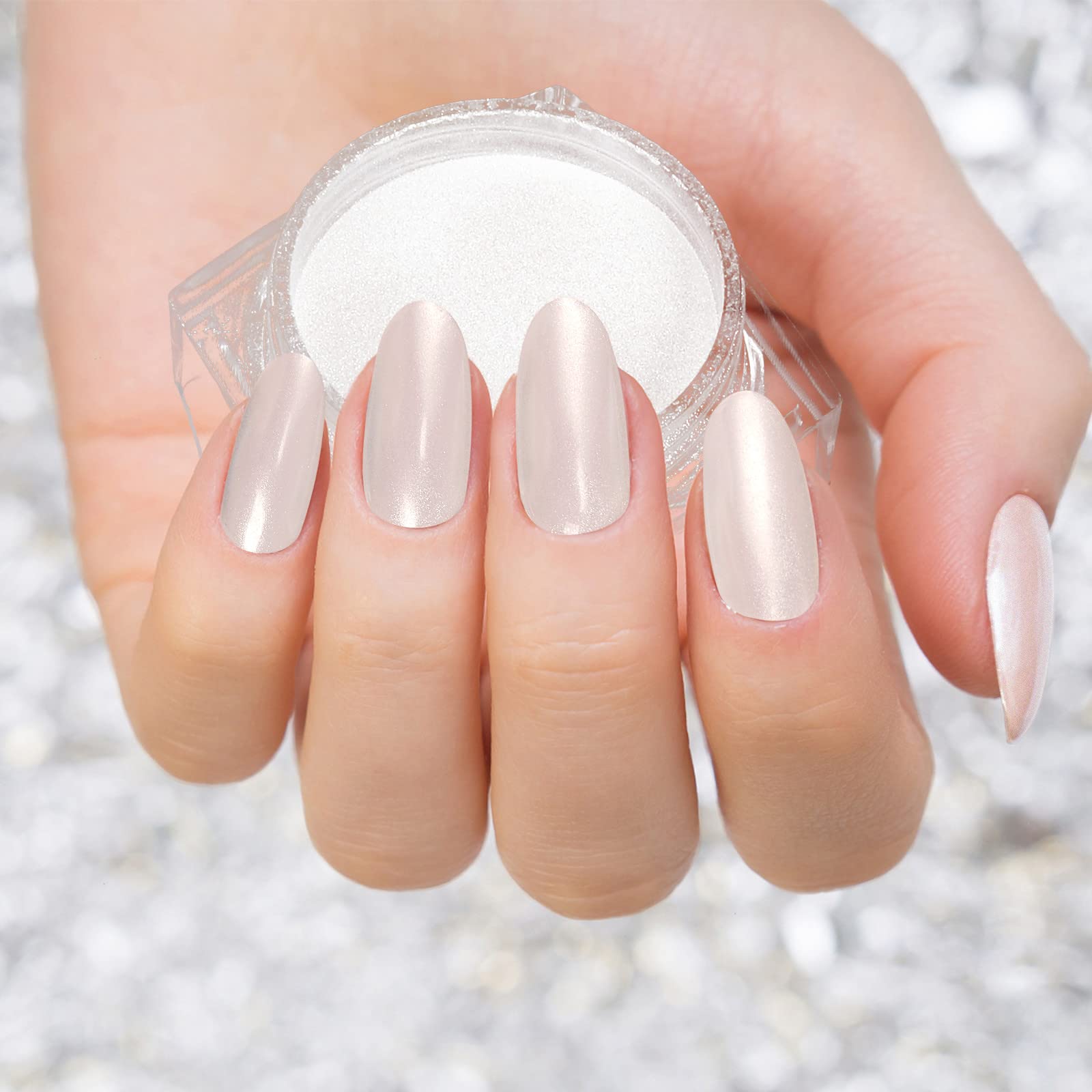 Hand model displaying metallic mirror effect nails