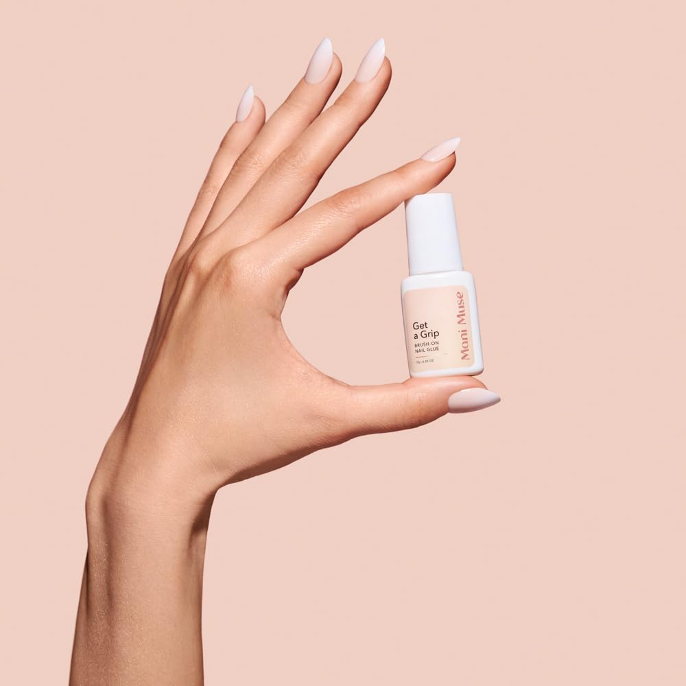 Close up of Mani Muse brush on nail adhesive applicator