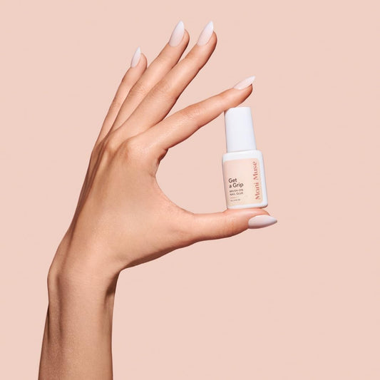 Close up of Mani Muse brush on nail adhesive applicator