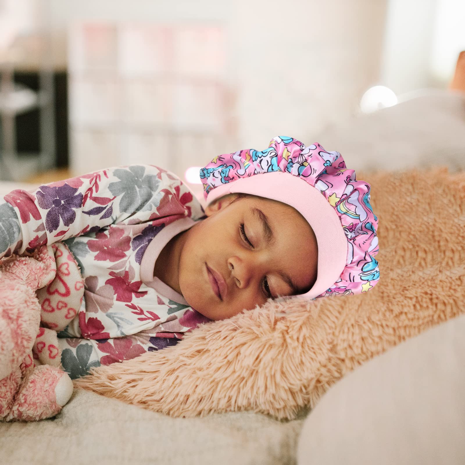 Close up view of the comfortable drawstring toggle on the toddler hair bonnet