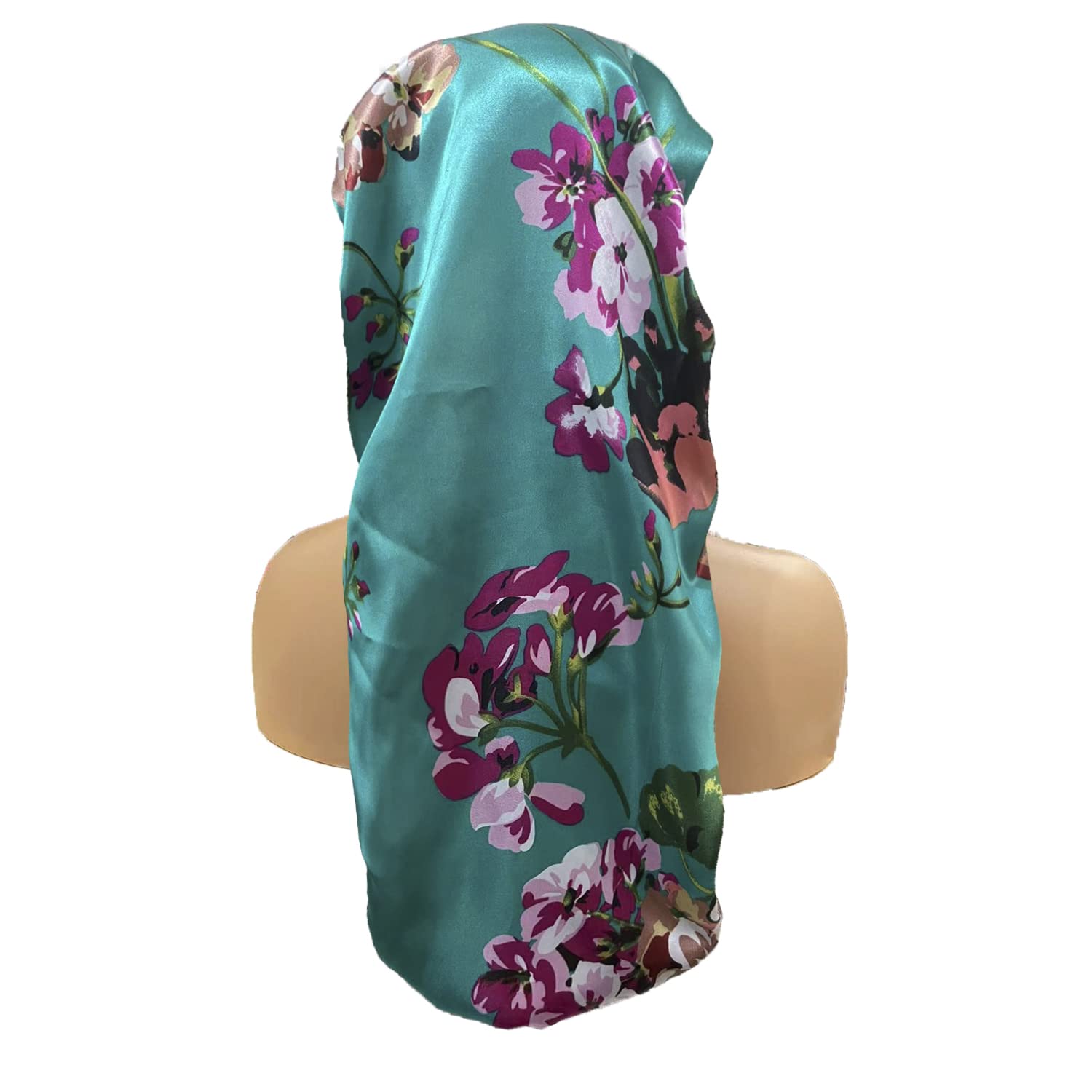 Side profile of a woman wearing the long floral satin bonnet protecting her long natural hair.