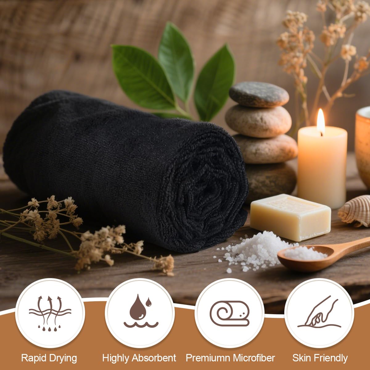 Stack of twenty four black Orighty multi purpose towels for gym spa and salon environments
