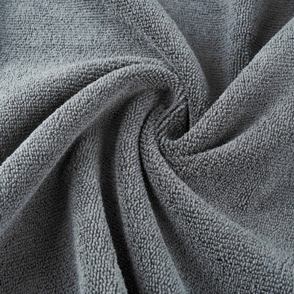 Two pack of gray MICROFI quick dry hair towels folded neatly together.
