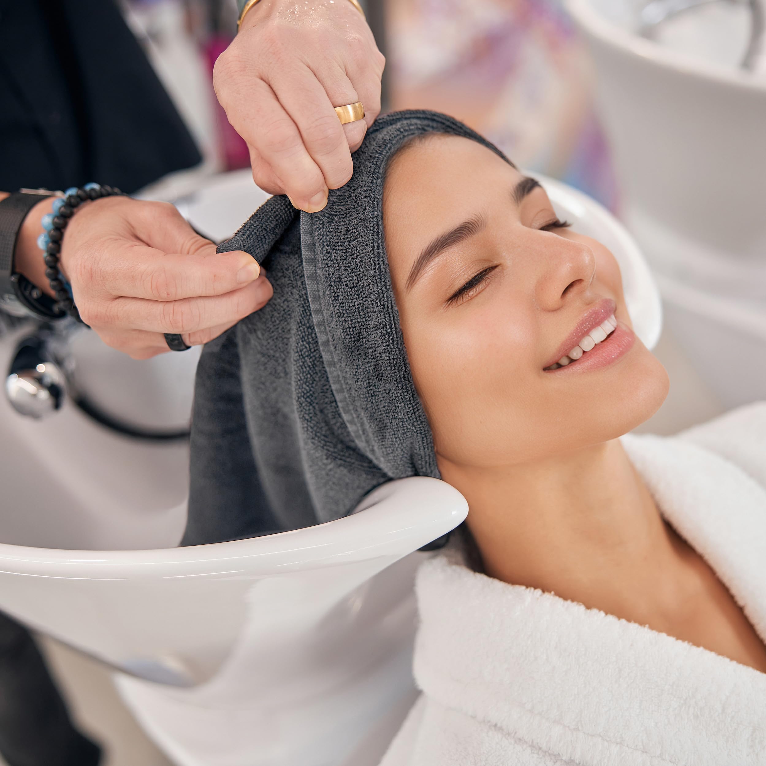 Premium imported gray hair towel by MICROFI showing the durable stitched borders.