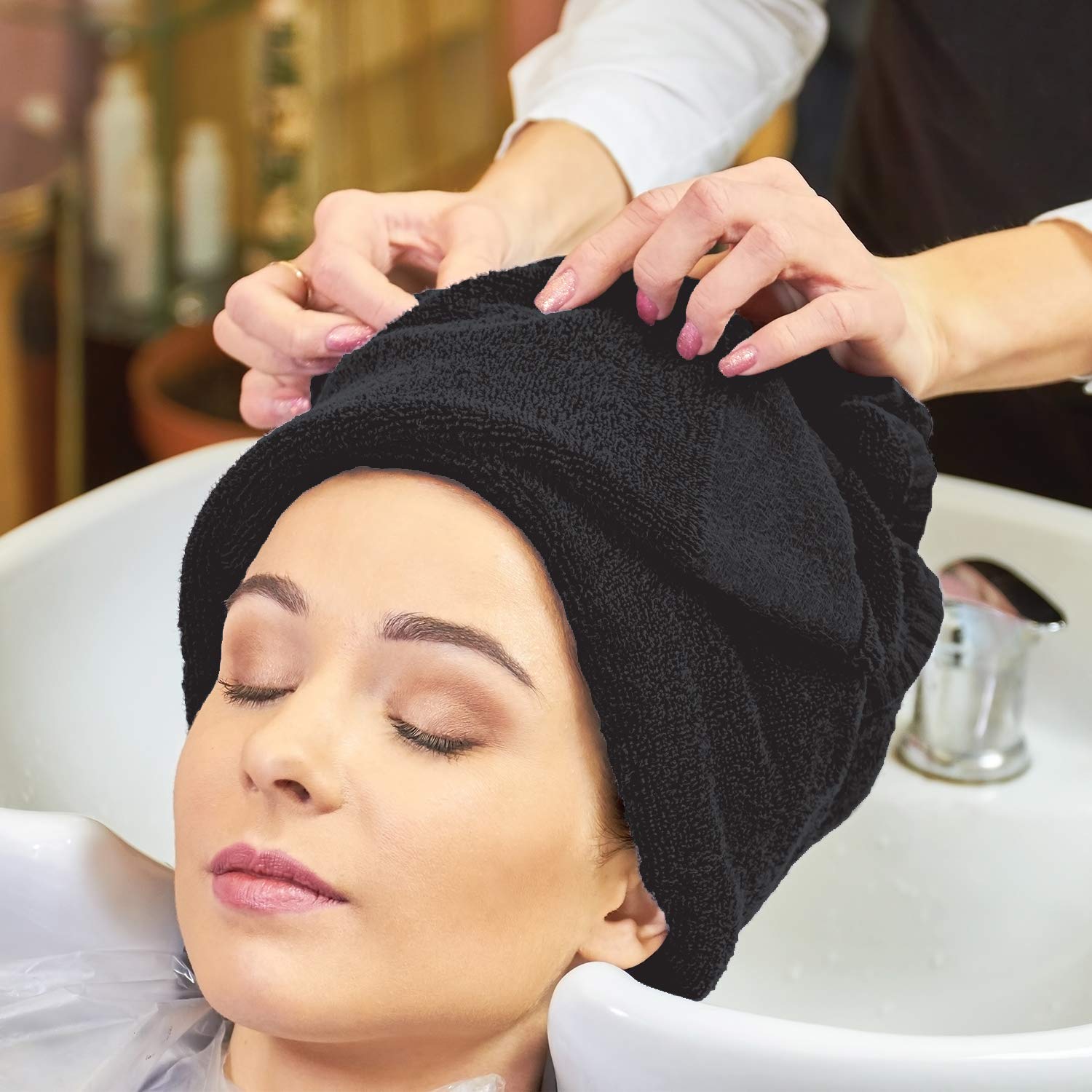 Arkwright bleach proof hand towels being used by a hair stylist in a salon setup.