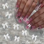 Flatback half pearls and bow charms layout for manicure