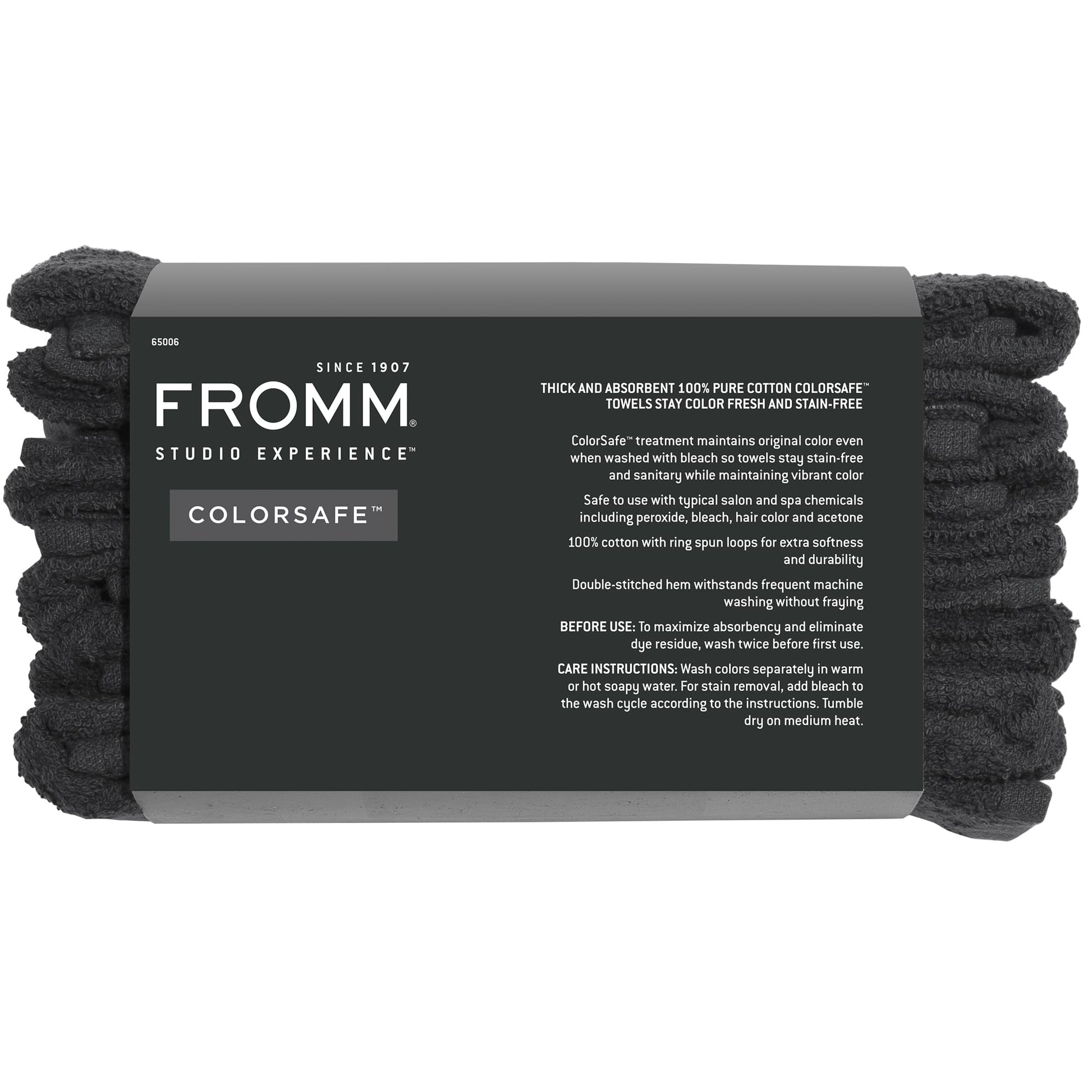 Professional hairstylist using Fromm black cotton salon towel