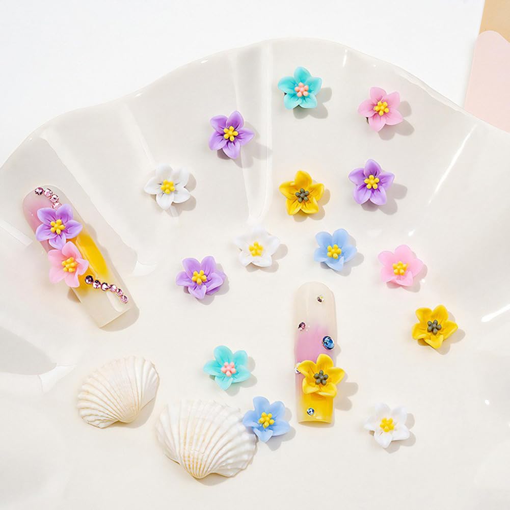Hand model displaying 3D flower nail art designs with pearls