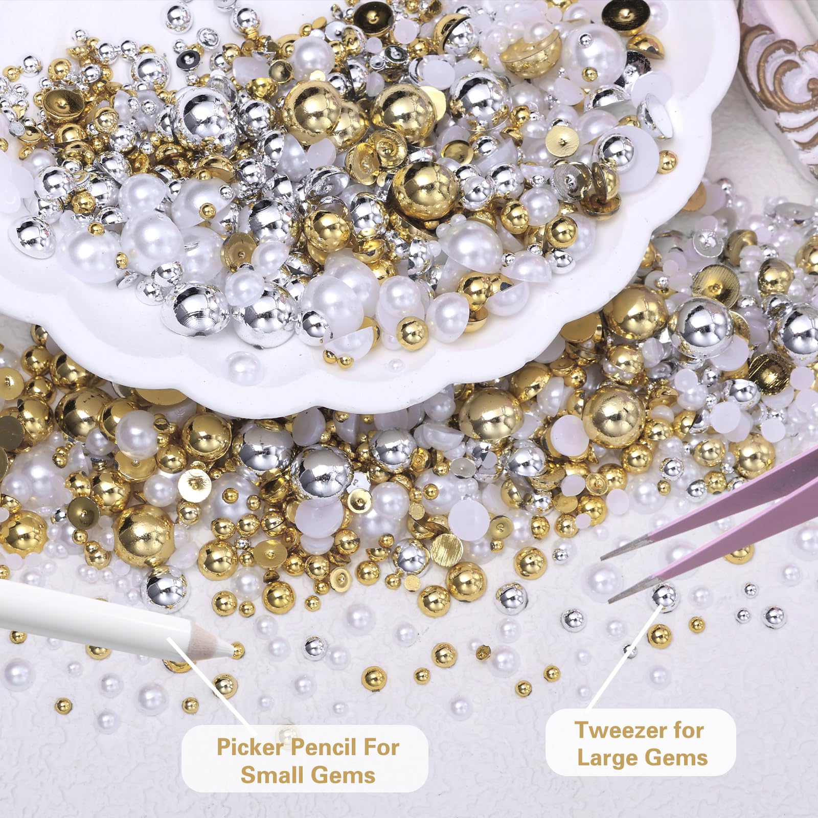 Close up of gold silver and white flatback pearl charms for crafting
