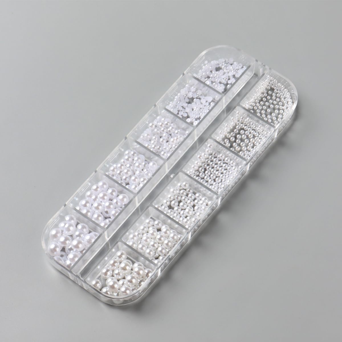 Professional nail art kit containing pearls and application tools