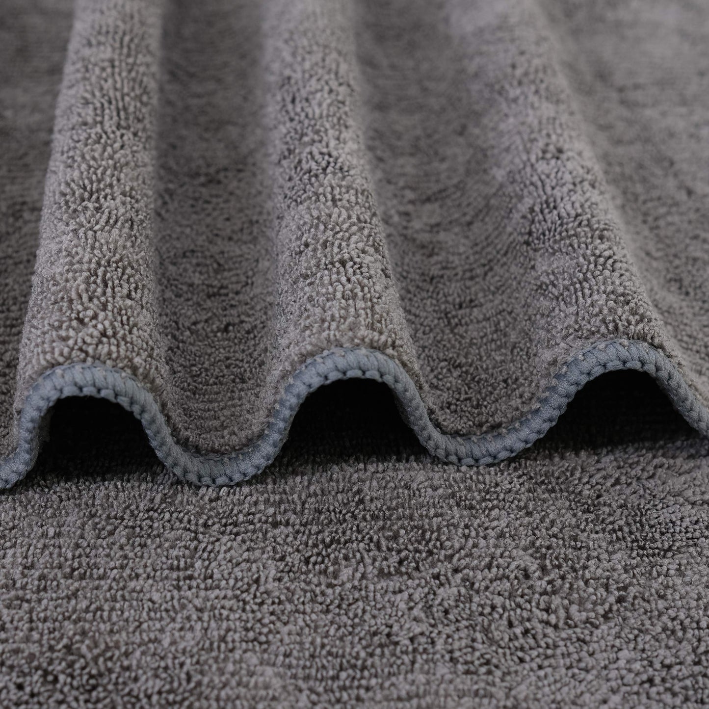 Two pack dark gray Polyte hair drying towels folded