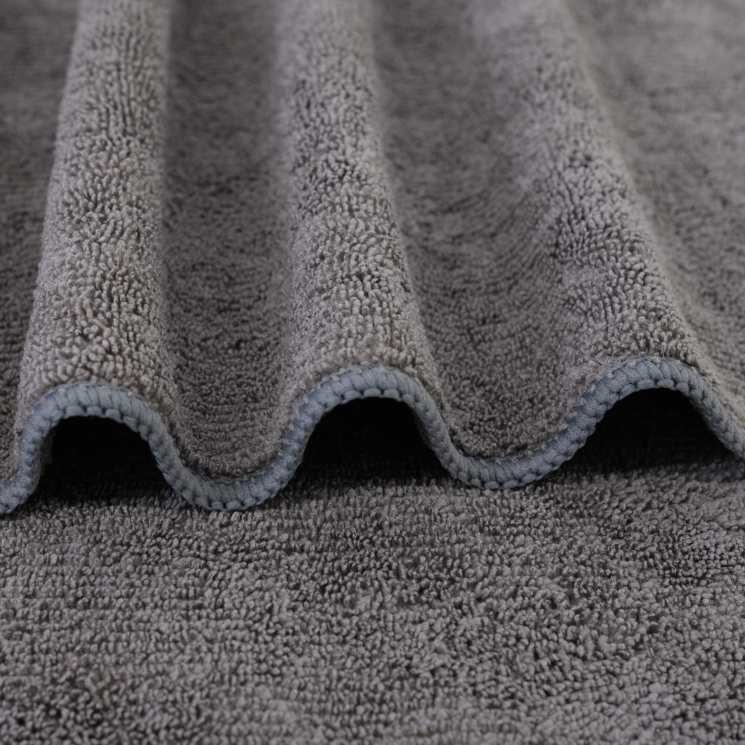 Two pack dark gray Polyte hair drying towels folded