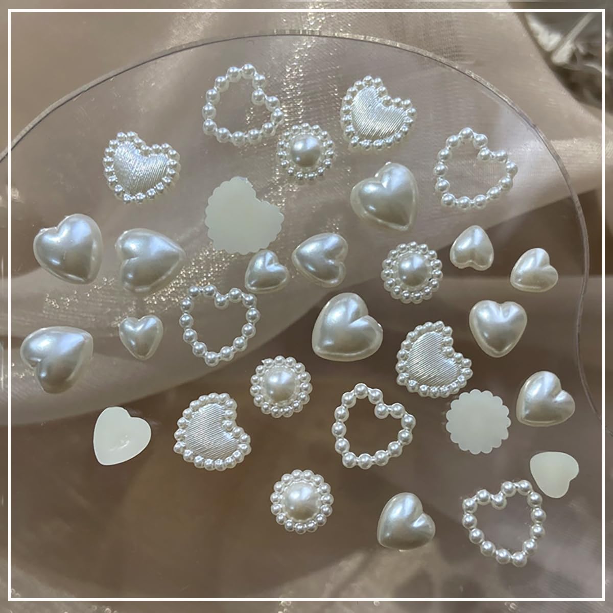 Top view of pearl nail jewelry set in organized storage