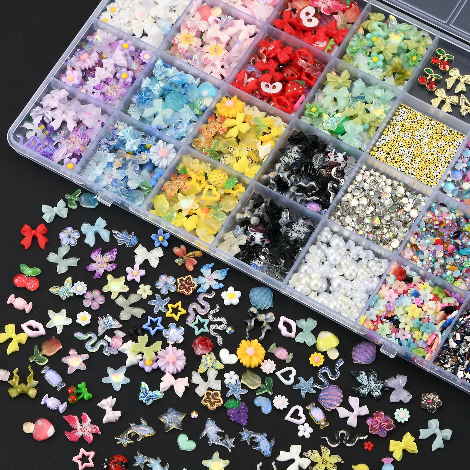 Open 28-grid organizer showing various nail rhinestones and pearls