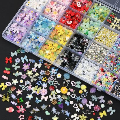 Open 28-grid organizer showing various nail rhinestones and pearls