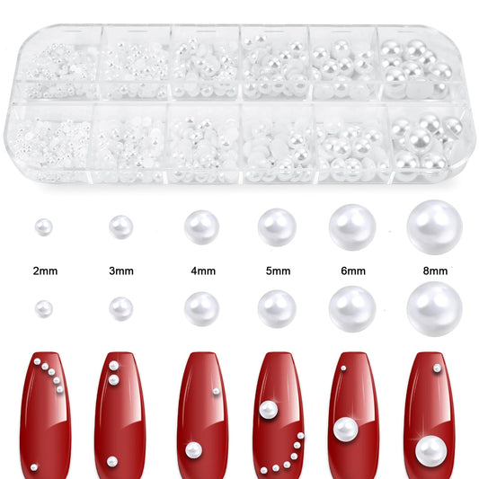 Assorted sizes of white flatback pearls in organizer box