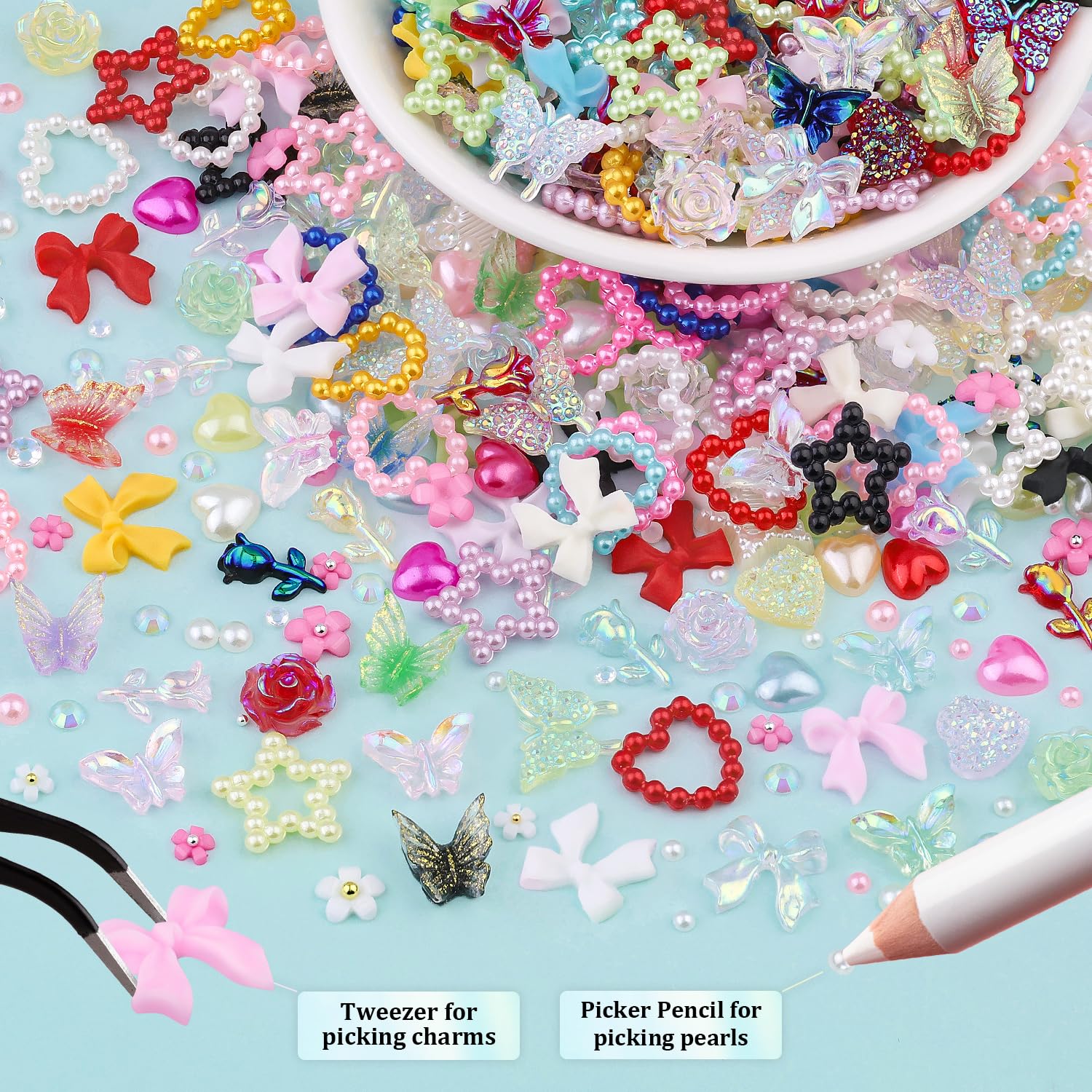 White nail pearls and flower charms for elegant nail art.