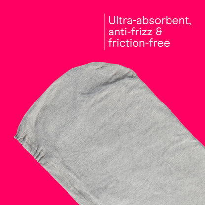 Woman wearing gray cotton hair towel wrap for curl protection