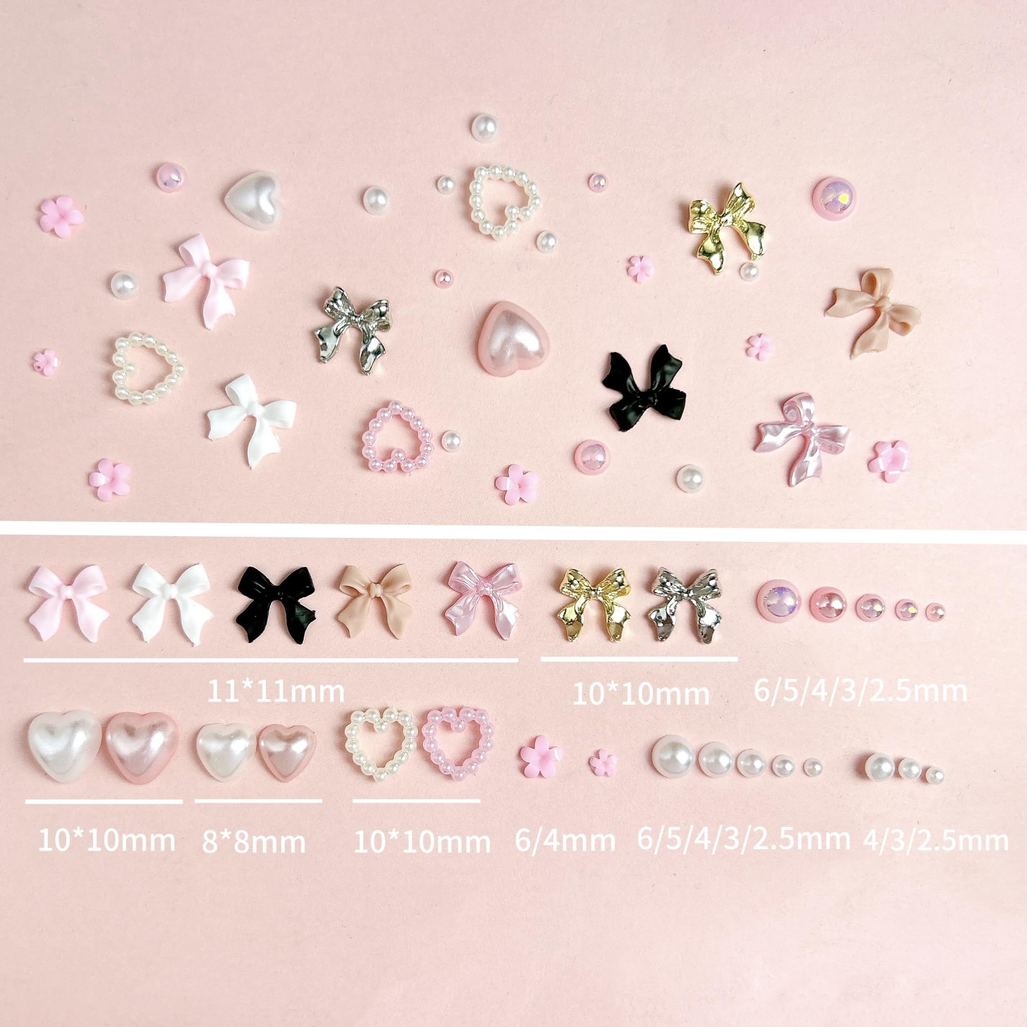 Hand model showing manicure with 3D nail charms applied