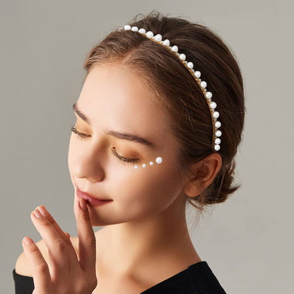 Applying Prudiut pearl gems for festival makeup looks