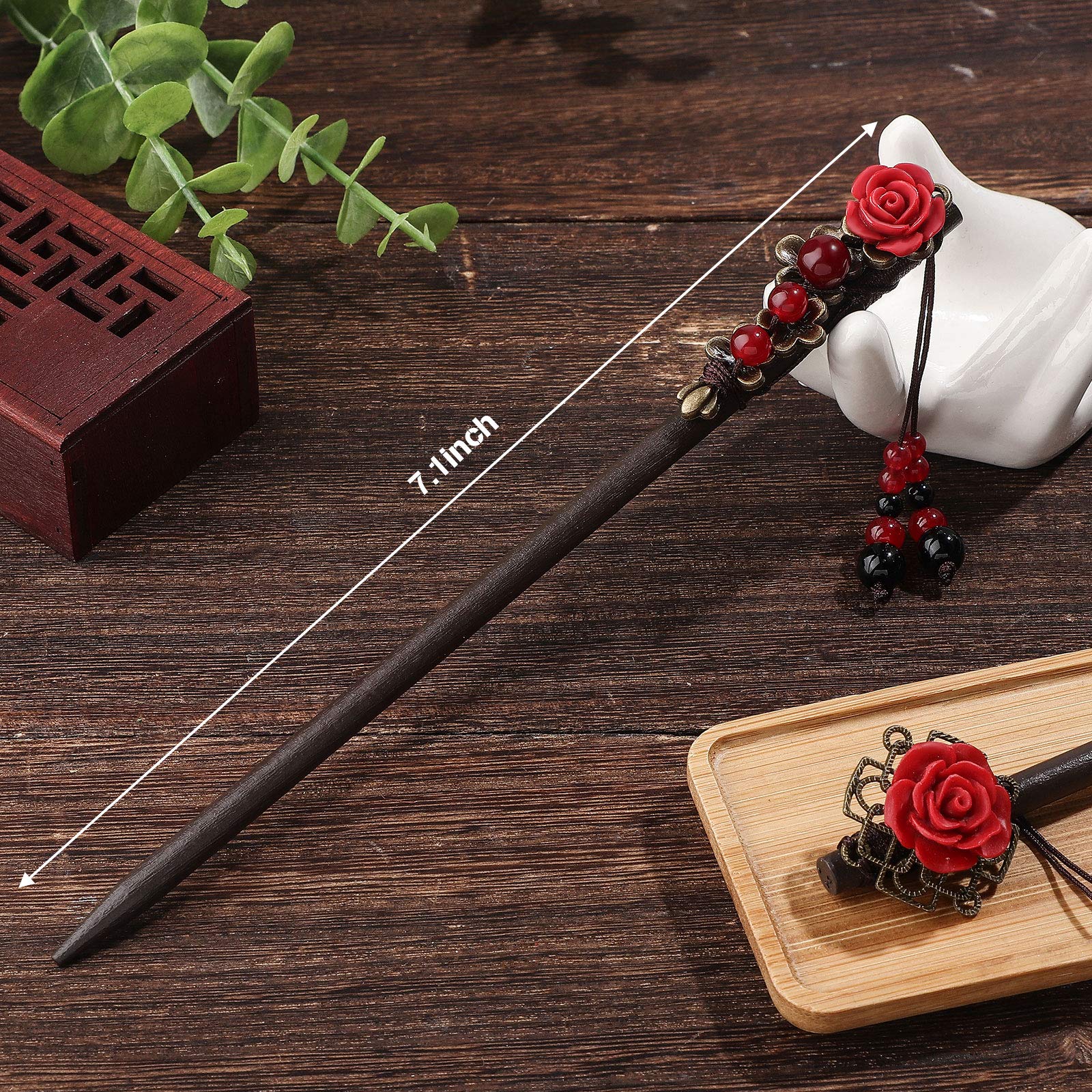 Two pieces of classic Japanese style handmade wooden hairpins displayed flat against a clean background.