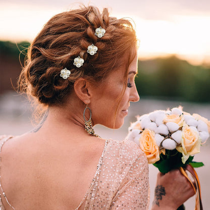 Close up view of the gold plated U shaped bridal bobby clips with elegant gemstone embellishments