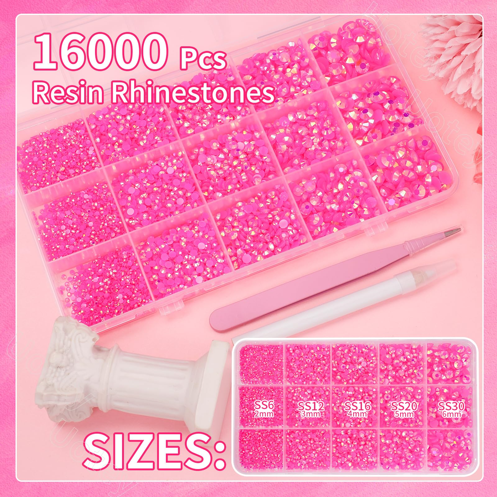 Close up of mixed size hot pink jelly resin rhinestones in storage box