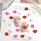 Assorted pink red and white 3D resin lip nail art charms spread out
