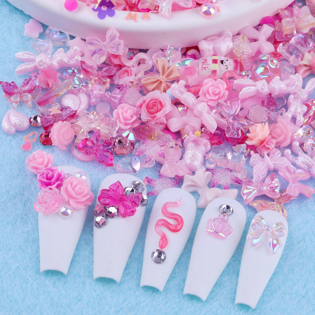 Example of a pink coquette style manicure created with the charms