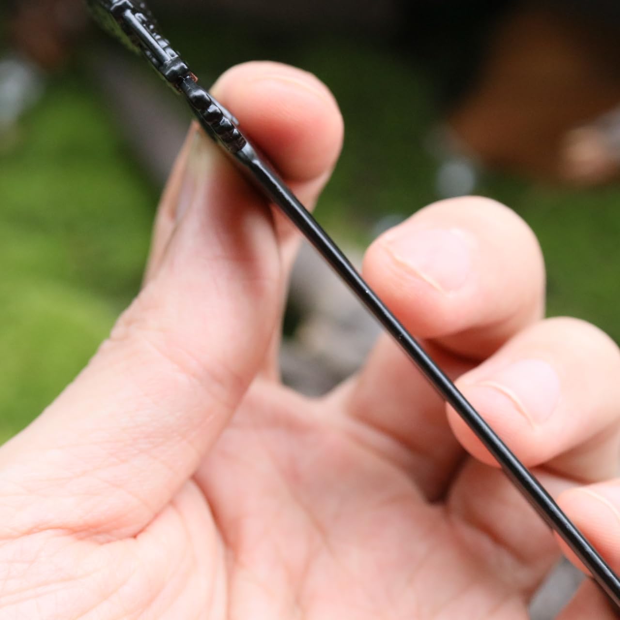Renaissance festival style metal hair fork securing a messy bun updo