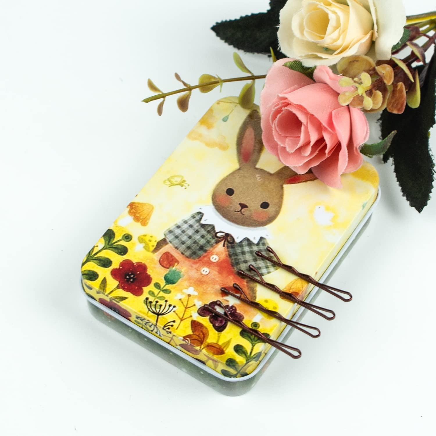 Small 1.38 inch bronze hair pins displayed next to animal print storage box