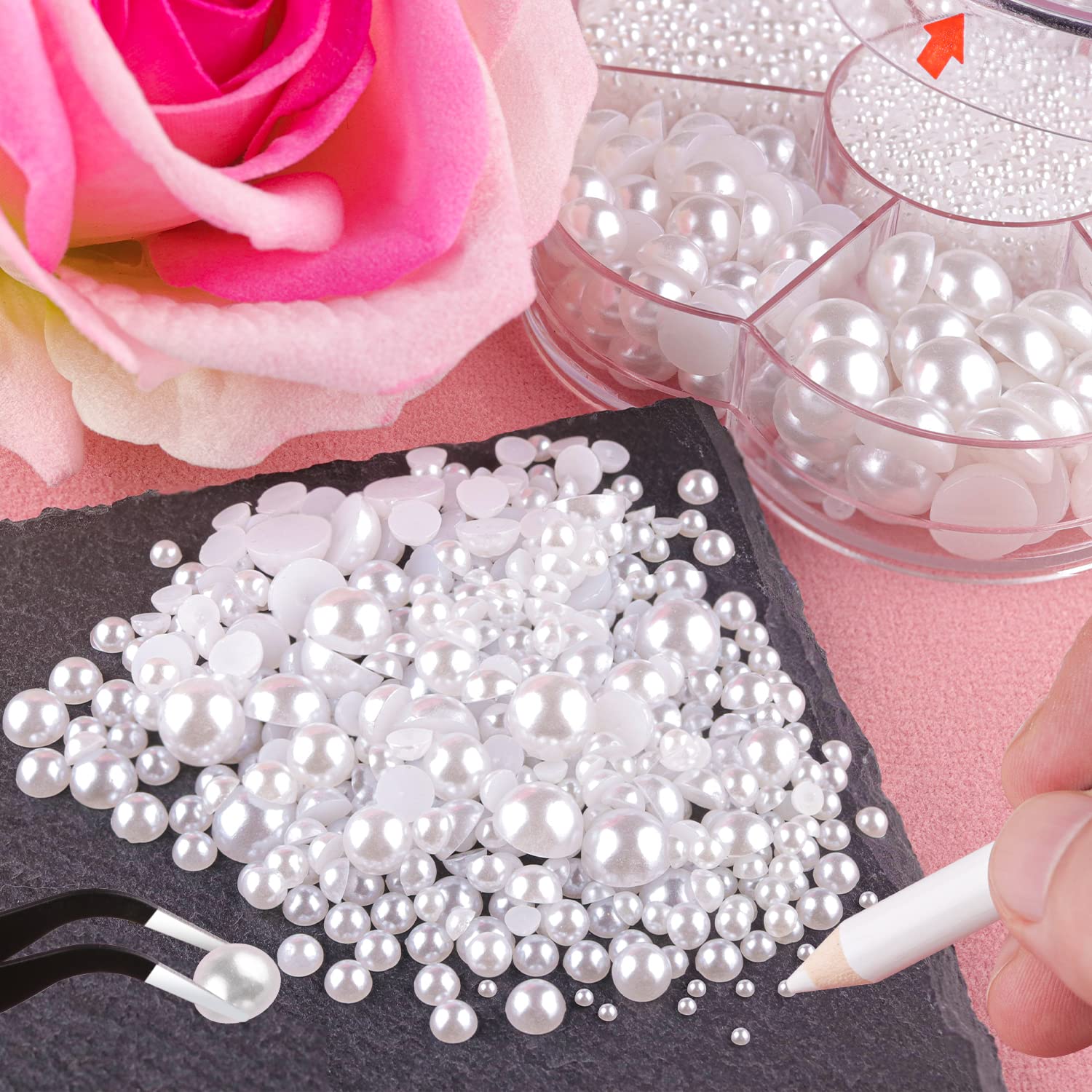 Close up of mixed size white half round flat back pearls