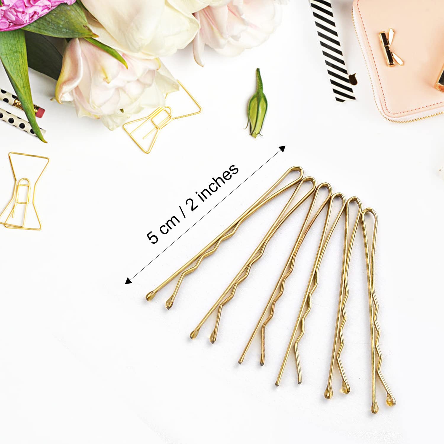 MORGLES premium metallic golden hair pins arranged neatly outside their clear plastic travel case