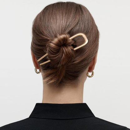 Side angle of the large metallic French hair clips for women.