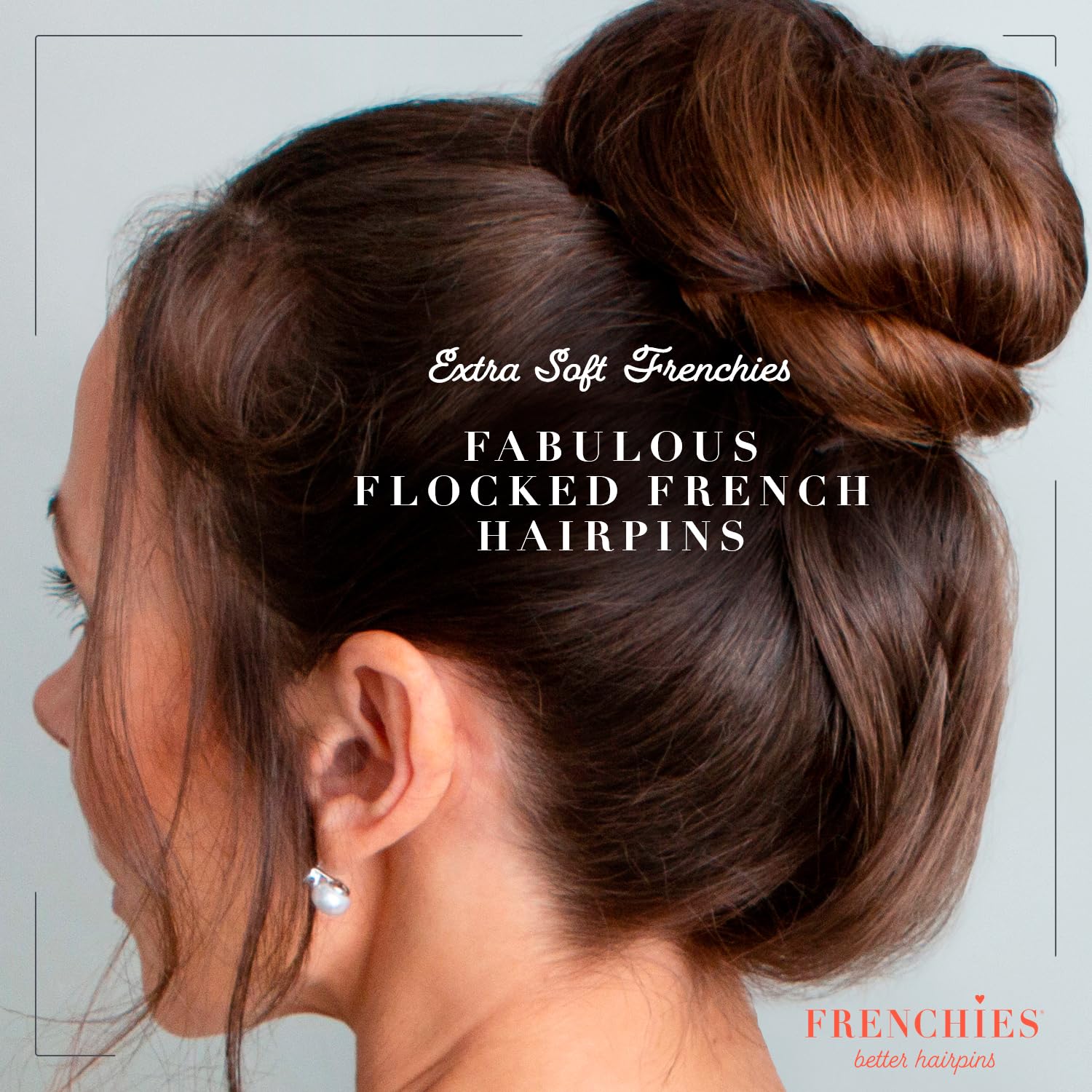 A woman using premium Frenchies U shaped hair pins to secure a sleek French twist.