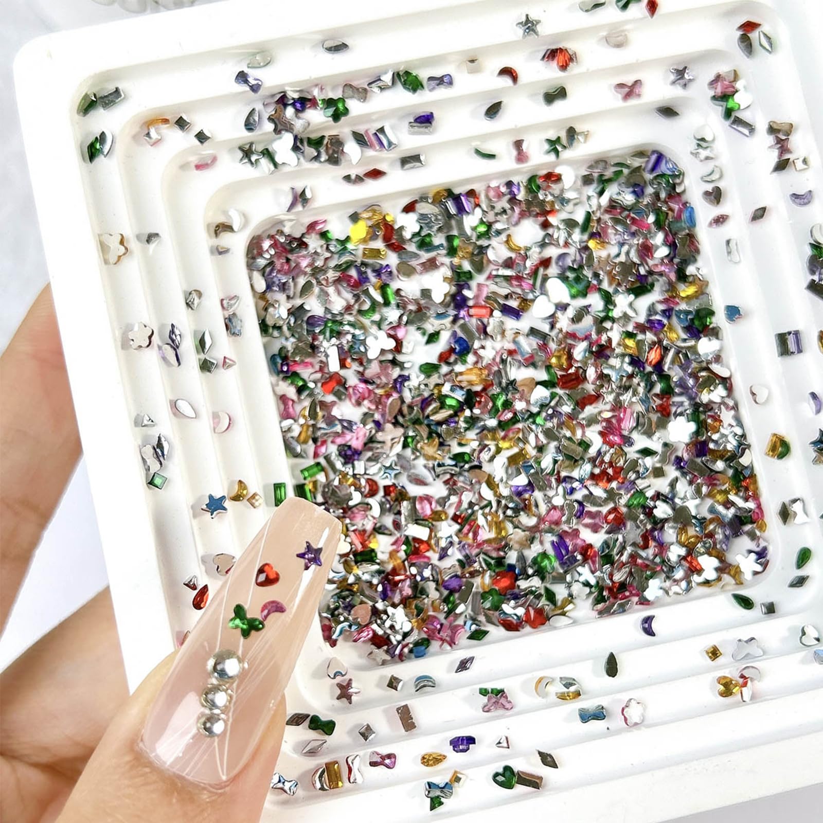 Close up of 3D multicolor heart and star nail rhinestones