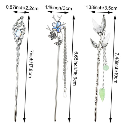 Detailed view of the intricate crescent moon and star charms on the vintage hair chopsticks.