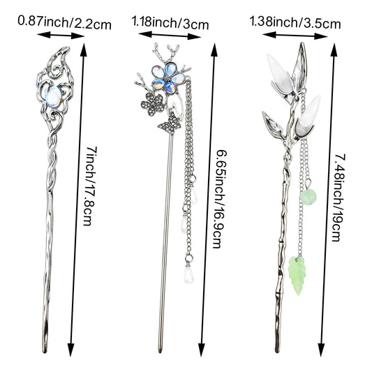 Detailed view of the intricate crescent moon and star charms on the vintage hair chopsticks.